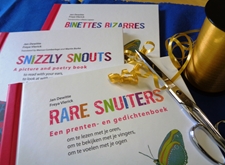 De boeken 'Rare snuiters', 'Snizzly Snouts' en 'Binettes Bizarres', met feestelijk inpakmateriaal